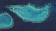 NASA satellite image of Heron Reef and the eastern end of Wistari Reef in the southern Great Barrier Reef, Australia.